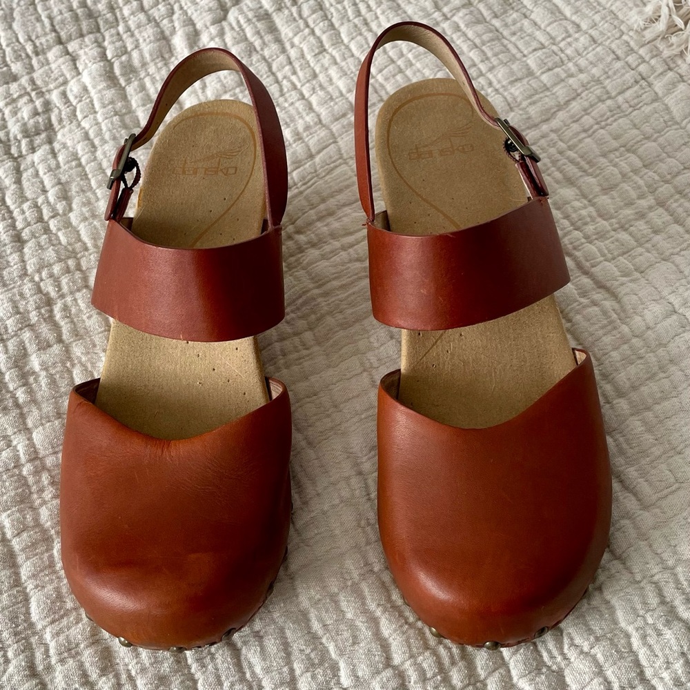 Dansko closed toe sandal with cute cutout wedge heel.